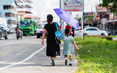 Mon and daughter walking 